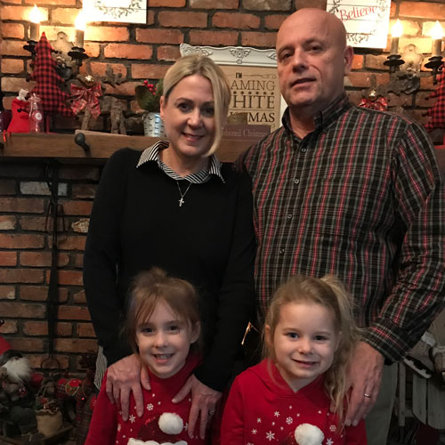 Jim and family around Christmas time